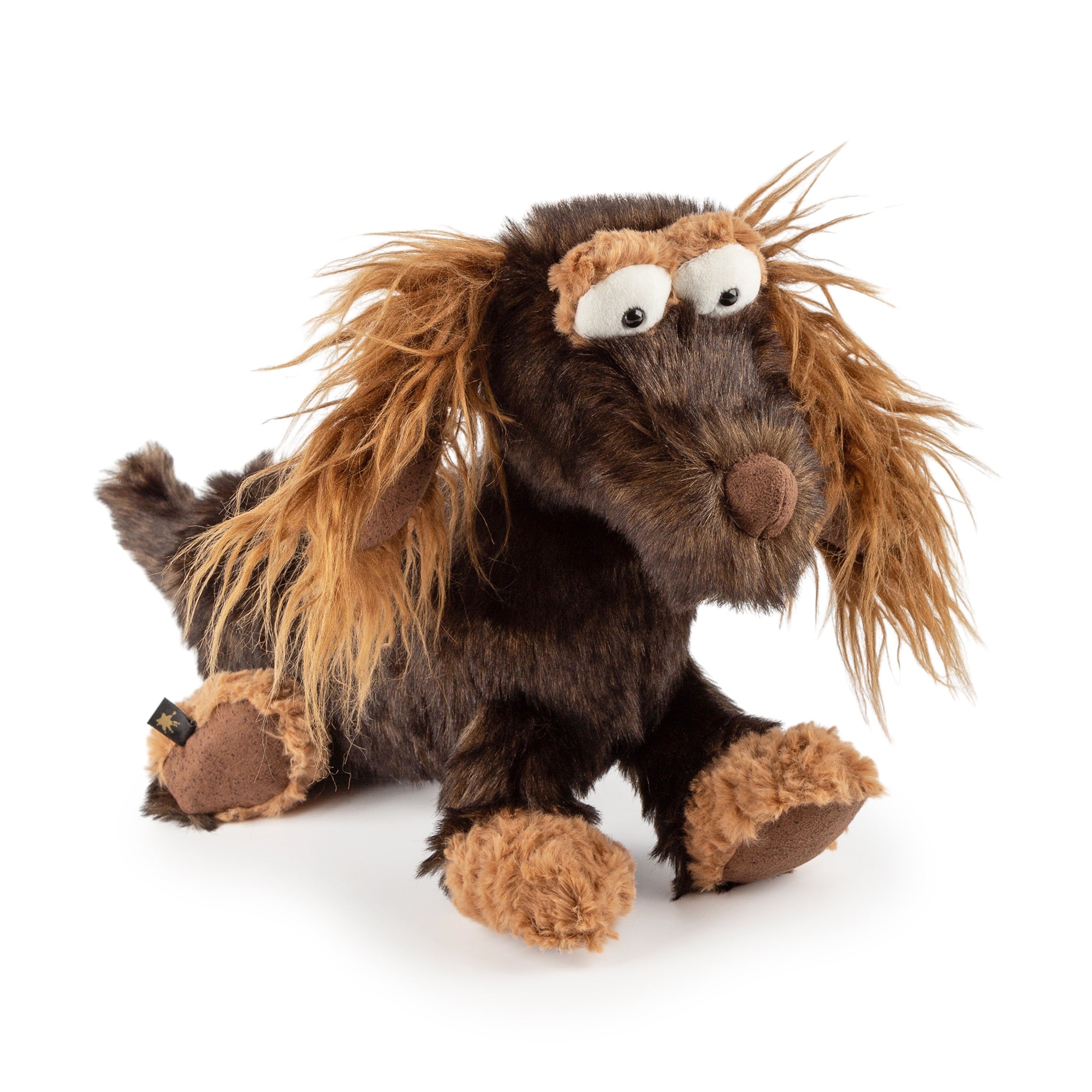 Plush toy resembling a dog with brown and black fur on a white background